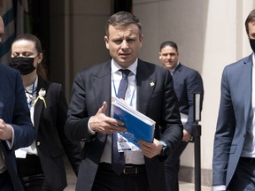 FILE - Ukraine Finance Minister Serhiy Marchenko walks outside of the International Monetary Fund (IMF) building during the World Bank/IMF Spring Meetings in Washington, on April 21, 2022. Ukraine's finance minister says crucial Western financial aid is "not charity" but "self-preservation" as donor countries share the price of turning back Russian aggression. Marchenko told The Associated Press in an interview Thursday, Dec. 8 that his country is protecting freedom and democracy far beyond its borders.