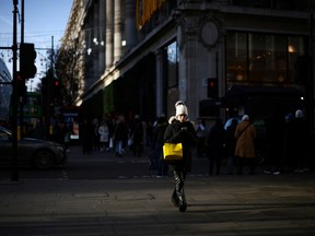 A person walks along Oxford Street in London, on Dec. 27.