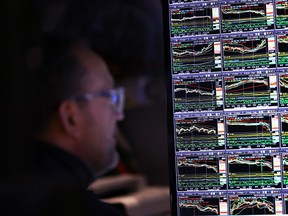 Traders work on the floor of the New York Stock Exchange during morning trading.