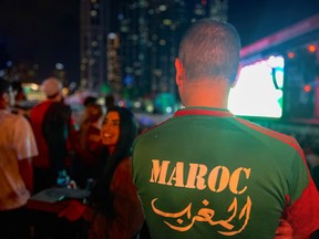 Fans watch the FIFA World Cup Qatar 2022 match between Morocco and France in Dubai, United Arab Emirates.