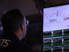 Traders work on the floor of the New York Stock Exchange during afternoon trading in New York City.