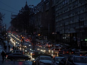 Cars on a street during a transport collapse due to subway stopping during a power blackout after critical civil infrastructure was hit by Russian missile attacks in Kyiv, Ukraine.