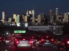 FILE - Traffic moves along the 110 Freeway in Los Angeles on Nov. 22, 2022. Fuel economy for 2021 model year vehicles in the U.S. stayed flat with 2020, as people continued to buy less-efficient trucks and SUVs, according to an annual government report published Monday, Dec. 12, 2022.