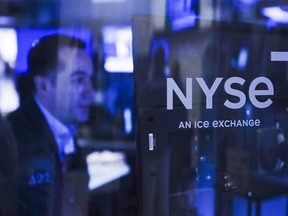 FILE - Traders work on the floor at the New York Stock Exchange in New York, Tuesday, Oct. 4, 2022. Stocks are opening lower on Wall Street, Thursday, Nov. 3, and Treasury yields are again bumping up against multiyear highs a day after the Federal Reserve indicated that its fight against inflation is far from over.