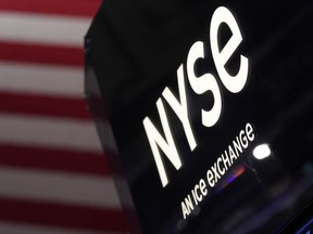 FILE - An NYSE sign is displayed at the New York Stock Exchange in New York, on Nov. 28, 2022. Stocks edged higher in morning trading on Wall Street Wednesday, Dec. 28, 2022, as investors count down to the end of the worst year for the S&P 500 since 2008.