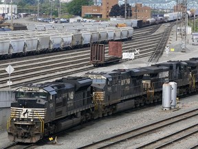 FILE - Norfolk Southern locomotives are moved in the in the Conway Terminal in Conway, Pa., Sept. 15, 2022. Major railroads now face pressure from investors to add sick time for workers after Congress declined to require them to do so as part of the contracts they imposed last week to avert a potentially devastating nationwide rail strike. The Interfaith Center on Corporate Responsibility said Monday, Dec. 5, that two investment managers it works with to help promote social change at companies had filed proposals at Union Pacific and Norfolk Southern railroads that will allow shareholders to vote on whether rail workers should get paid sick leave.