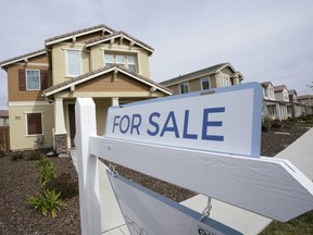 FILE - A For Sale sign is posted in front of a home in Sacramento, Calif., Thursday, March 3, 2022. On Thursday Freddie Mac reports on this week's average U.S. mortgage rates.