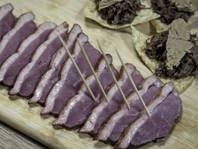 FILE - Samples of foie gras delicacy from ducks farmed at Hudson Valley Foie Gras duck farm are displayed on July 18, 2019, in Ferndale, N.Y. New York City's ban on the sale of foie gras, already delayed by a court challenge, has now been found in violation of state agricultural law.