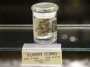 FILE - A jar of medical marijuana sits on a display case at the Thomas C. Slater Compassion Center in Providence, R.I., July 29, 2015. Rhode Island has become the latest state to allow recreational marijuana sales. Customers started lining up to buy recreational marijuana in the state on Thursday, Dec. 1, 2022, a little more than six months after Gov. Dan McKee signed the bill permitting such sales to people 21 and older into law.