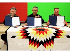 Fred Dermarkar, AECL President and CEO; Chief Derrick Henderson, Sagkeeng Anicinabe First Nation; and Joe McBrearty, CNL President and CEO, celebrate the launch of 'Nigan Aki,' an independent Sagkeeng environmental monitoring program that will be implemented at the Whiteshell Laboratories site