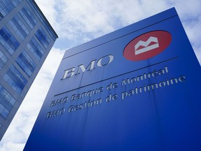 BMO Banque de Montreal signage in Ottawa on Wednesday Sept. 7, 2022. BMO Financial Group raised its dividend as it reported fourth-quarter net income of $4.48 billion, up from $2.16 billion in the same quarter last year, boosted by a one-time gain related to its purchase of Bank of the West.