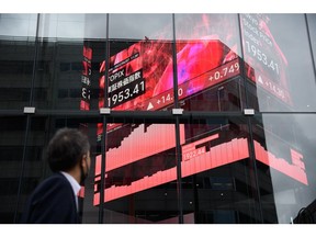 The Tokyo Stock Price Index displayed on a rotating-cube screen in an atrium of the Kabuto One building, next the Tokyo Stock Exchange, in Tokyo, Japan, on Tuesday, June 7, 2022. Japan equities were mixed after the yen slid to a 20-year low versus the dollar as the gap between domestic and US yields widened. Photographer: Akio Kon/Bloomberg