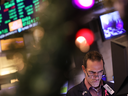 A stock trader works on the floor of the New York Stock Exchange on Dec. 21 in New York City. It's been a tough year for the classic 60/40 investment portfolio.