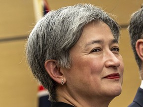 FILE- Australia's Foreign Minister Penny Wong visits the Japanese prime minister's office in Tokyo on Dec. 9, 2022. Australia has signed a new security deal with Oceania island country Vanuatu as part of an ongoing competition with China for influence in the Pacific.