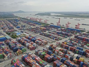 FILE - Containers are seen at a port in Nanjing in eastern China's Jiangsu province on Oct. 27, 2022. China's imports and exports shrank in November as global demand weakened and anti-virus controls weighed on the second-largest economy. (Chinatopix via AP, File)