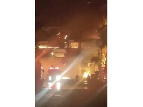 This image made from video provided by Disaster Response Association Thailand shows a fire at the Grand Diamond City Casino and Hotel in the border town of Poipet, Cambodia, Thursday, Dec. 29, 2022. A fire burning through a Cambodian hotel casino has killed multiple people and injured dozens of others, police said Thursday, and neighboring Thailand sent firetrucks to help fight the blaze in a bustling border region.(Disaster Response Association Thailand via AP)