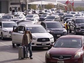 Cars line up to pick up travelers at Love Field Airport in Dallas, Wednesday, Dec. 21, 2022.