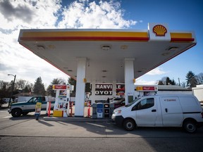 Motorists fuel up vehicles at a Shell gas station in Vancouver, on Tuesday, March 8, 2022. Shell Canada says its purchase of 56 gas stations from the parent company of Sobeys is part of Shell's long-term plan to grow its network of retail fuel stations across the country.THE CANADIAN PRESS/Darryl Dyck