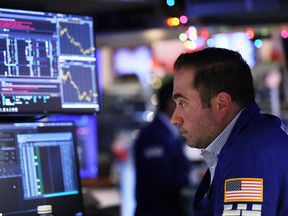 Traders work on the floor of the New York Stock Exchange on Dec. 6.