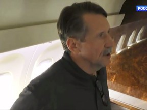 In this image taken from video provided by RU-24 Russian Television on Friday, Dec. 9, 2022, Russian citizen Viktor Bout who was exchanged for U.S. basketball player Brittney Griner, speaks in a Russian plane after a swap, in the airport of Abu Dhabi, United Arab Emirates. Russian arms dealer Bout, who was released from U.S. prison in exchange for WNBA star Griner, is widely labeled abroad as the "Merchant of Death" who fueled some of the world's worst conflicts but seen at home as a swashbuckling businessman unjustly imprisoned after an overly aggressive U.S. sting operation. (RU-24 Russian Television via AP)