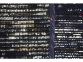 Electrical lights illuminate offices inside a commercial building at night in London, U.K., on Thursday, Nov. 17, 2016. More than 1,900 firms are likely to review their office-space requirements in London following the U.K.'s decision to leave the European Union. Photographer: Simon Dawson/Bloomberg
