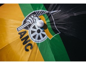 The ANC logo sits atop an umbrella hat during the 54th national conference of the African National Congress party in Johannesburg, South Africa, on Sunday, Dec. 17, 2017. The leadership conference of South Africa's ruling African National Congress party has accepted the credentials of the delegates, opening the way for the start of voting to choose the party's top officials, according to five people familiar with the deliberations. Photographer: Waldo Swiegers/Bloomberg