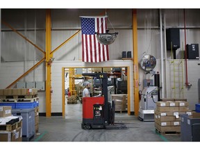 A worker operates a forklift at a manufacturing facility in Virginia Beach, Virginia. Photographer: Luke Sharrett/Bloomberg