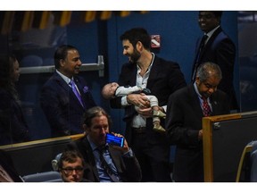 Ardern's partner Clarke Gayford holds their baby Neve during the United Nations General Assembly in September 2018. Photographer: Stephanie Keith/Getty Images