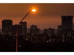 A street light stands illuminated in the central business district Pretoria, South Africa, on Saturday, June 1, 2019. While South African President Cyril Ramaphosa says power utility Eskom Holdings SOC Ltd. is considered too big to fail, it could be too big to support because of the costs associated with stabilizing its finances, Engineering News reported, citing S&P Global Ratings Director Ravi Bhatia.