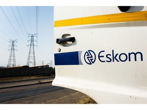 A company logo sits on an Eskom Holdings SOC Ltd. maintenance truck door in Soweto, South Africa, on Tuesday, Aug. 8, 2019. Eskom, South Africa's biggest polluter, said emissions of particulate matter that cause chronic respiratory disease are at their highest level in two decades as the state power utility's financial meltdown has seen it skip maintenance and has triggered strikes.