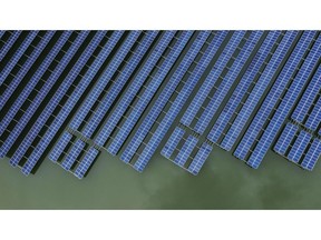 Photovoltaic panels stand in a floating solar farm in this aerial photograph taken on the outskirts of Ningbo, Zhejiang Province, China, on Wednesday, April 22, 2020. China's top leaders softened their tone on the importance of reaching specific growth targets this year during the latest Politburo meeting on April 17, saying the nation is facing "unprecedented" economic difficulty and signaling that more stimulus was in the works. Photographer: Qilai Shen/Bloomberg
