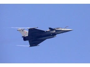 An Indian Air Force Dassault Rafale fighter jet performs a flying display during Air Force Day Parade at Hindon Air Force Station in Ghaziabad, Uttar Pradesh, India, on Thursday 8th October, 2020. In May Chief of Defence Staff Bipin Rawat said India plans to switch to locally-made fighter jets, two years after asking global companies to submit proposals to supply 114 combat aircraft in the world's biggest warplane contract. Photographer: T. Narayan/Bloomberg