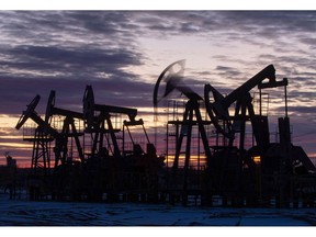 Oil pumping jacks, also known as "nodding donkeys", operate in an oilfield near Neftekamsk, in the Republic of Bashkortostan, Russia, on Thursday, Nov. 19, 2020. The flaring coronavirus outbreak will be a key issue for OPEC+ when it meets at the end of the month to decide on whether to delay a planned easing of cuts early next year. Photographer: Andrey Rudakov/Bloomberg