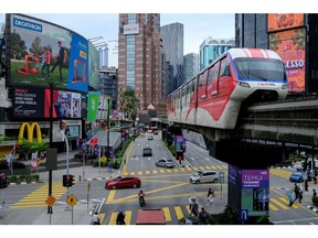 A Rapid KL train, operated by Prasarana Malaysia Bhd., travels along an elevated track in Kuala Lumpur, Malaysia, on Tuesday, Jan. 12, 2021. Malaysia's king declared a state of emergency in the Southeast Asian nation, in a move that could allow the embattled government to delay elections as it tackles the worsening coronavirus pandemic.