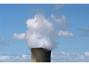 Vapor rises from a cooling tower at the EnergyAustralia Pty. Yallourn Power Station in the Latrobe Valley, Australia, on Tuesday, Oct. 26, 2021. Australia's Prime Minister finally agreed to a plan to zero out its carbon emissions by 2050, but said he wouldn't enshrine the target in law, and would continue to rely on fossil fuels and projects designed to offset planet-warming pollution. Photographer: Carla Gottgens/Bloomberg