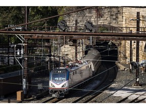 An Amtrak train exits the Baltimore and Potomac Tunnel. Photographer: Drew Angerer/Getty Images