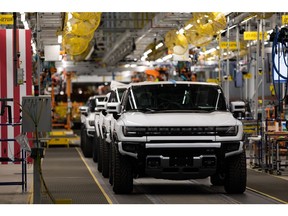GMC Hummer electric vehicles on the production line at General Motors' Factory ZERO all-electric vehicle assembly plant in Detroit, Michigan, U.S., on Wednesday, Nov. 17, 2021. General Motors invested $2.2 billion in Factory ZERO, the single largest investment in a plant in GM history. Photographer: Emily Elconin/Bloomberg