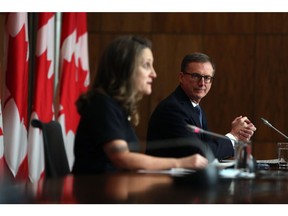 Tiff Macklem, governor of the Bank of Canada, listens during a news conference with Chrystia Freeland, Canada's deputy prime minister and finance minister, in Ottawa, Ontario, Canada, on Monday, Dec. 13, 2021. The Bank of Canada will maintain its 2% inflation target for the next five years, but has formally been given license to moderately overshoot it to "support maximum sustainable employment."