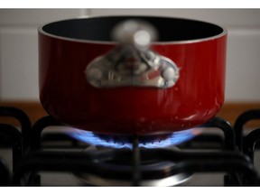 Natural gas burns on a domestic kitchen stove in Rome, Italy, on Wednesday, Dec. 29, 2021. European gas prices declined to near the lowest level in three weeks, with increased inflows at terminals in the region bringing relief to the tight market.