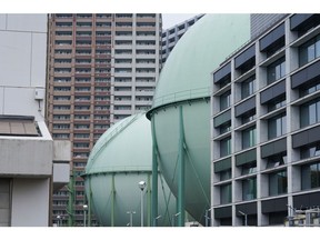 Tokyo Gas Co. storage tanks at the company's Hiranuma facility, are seen at a residential area in Yokohama, Japan, on Wednesday, April 20, 2022. Photographer: Toru Hanai/Bloomberg