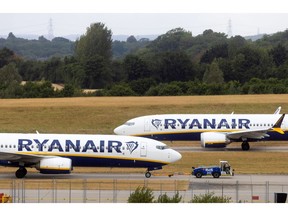 Passenger aircraft, operated by Ryanair Holdings Plc, on the runway at London Stansted Airport, operated by Manchester Airport Plc, in Stansted, U.K., on Monday, July 25, 2022. Ryanair said passengers remain cautious about booking, clouding its prospects beyond a summer travel boom in which it's suffering less disruption than many of its rivals.