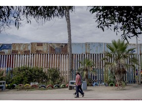 A section of the Mexico and US border fence in Tijuana, Mexico, on Sunday, Aug. 7, 2022. Mexican migrants attempting to cross into the US without adequate documentation outnumbered those from Central America in the first six months of this year, a reversal after a slowdown due to the Covid-19 pandemic.