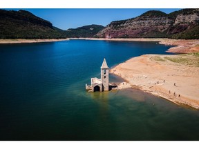 Ruins of the Sant Roma church, exposed by low water levels in the Sau reservoir following drought, in Vilanova de Sau, Spain, on Saturday, Aug. 20, 2022. In the midst of an arid summer that set heat records across Europe, the continent's rivers are evaporating.