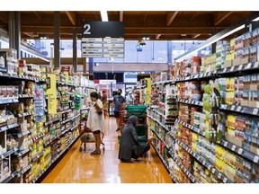 Shoppers at a grocery store in Toronto, Ontario, Canada, on Thursday, Sept. 1, 2022. The share of Canadians who expressed some confidence that the central bank remains committed to its 2% inflation target jumped to 57%, according to a Nanos Research Group survey conducted for Bloomberg News.