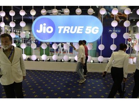 Visitors at the Reliance Jio Infocomm Ltd. booth at India Mobile Congress 2022 exhibition in New Delhi, India, on Saturday, Oct. 1, 2022. Narendra Modi, India's prime minister, announced the launch of 5G services in India during the event on Oct. 1.