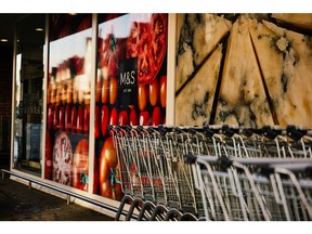 Shopping trolleys outside a Marks and Spencer Group Plc store in Reigate, UK, on Wednesday, Nov. 16, 2022. UK inflation rose more than expected to a 41-year high of 11.1%, adding to pressure on the Bank of England to raise interest rates again.