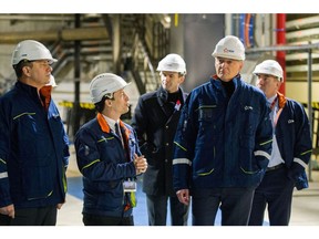 Bruno Le Maire, France's finance minister, second right, and Luc Remont, chief executive officer of Electricite de France SA, second left, at the Penly nuclear power plant in Penly, France, on Friday, Dec. 9, 2022. France's nuclear reactors are returning to the market just as the cold snap worsens, Remont said the restart of its units provides confidence that it can make it through a challenging winter.