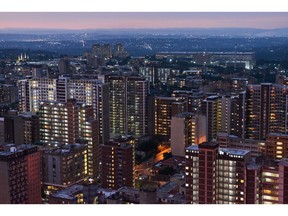 Lit residential tower blocks at night, viewed from the Ponte City Apartments building, in the Berea district of Johannesburg, South Africa, on Thursday, Dec. 22, 2022. Johannesburg, South Africa's economic hub and its richest city, is seeking electricity supply from private generators to reduce the amount of scheduled power outages. Photographer: Waldo Swiegers/Bloomberg