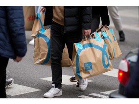 A shopper carries Primark branded bags Photographer: Paul Hanna/Bloomberg