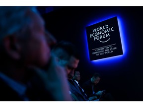 An illuminated logo during a panel session on the opening day of the World Economic Forum (WEF) in Davos, Switzerland, on Tuesday, Jan. 17, 2023. The annual Davos gathering of political leaders, top executives and celebrities runs from January 16 to 20. Photographer: Stefan Wermuth/Bloomberg
